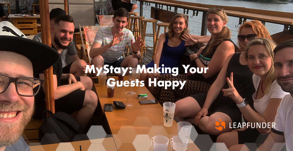 A team of people posing for a photo in a bar